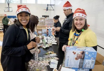 women packing boxes at christmas