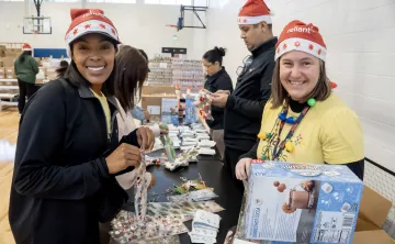 women packing boxes at christmas